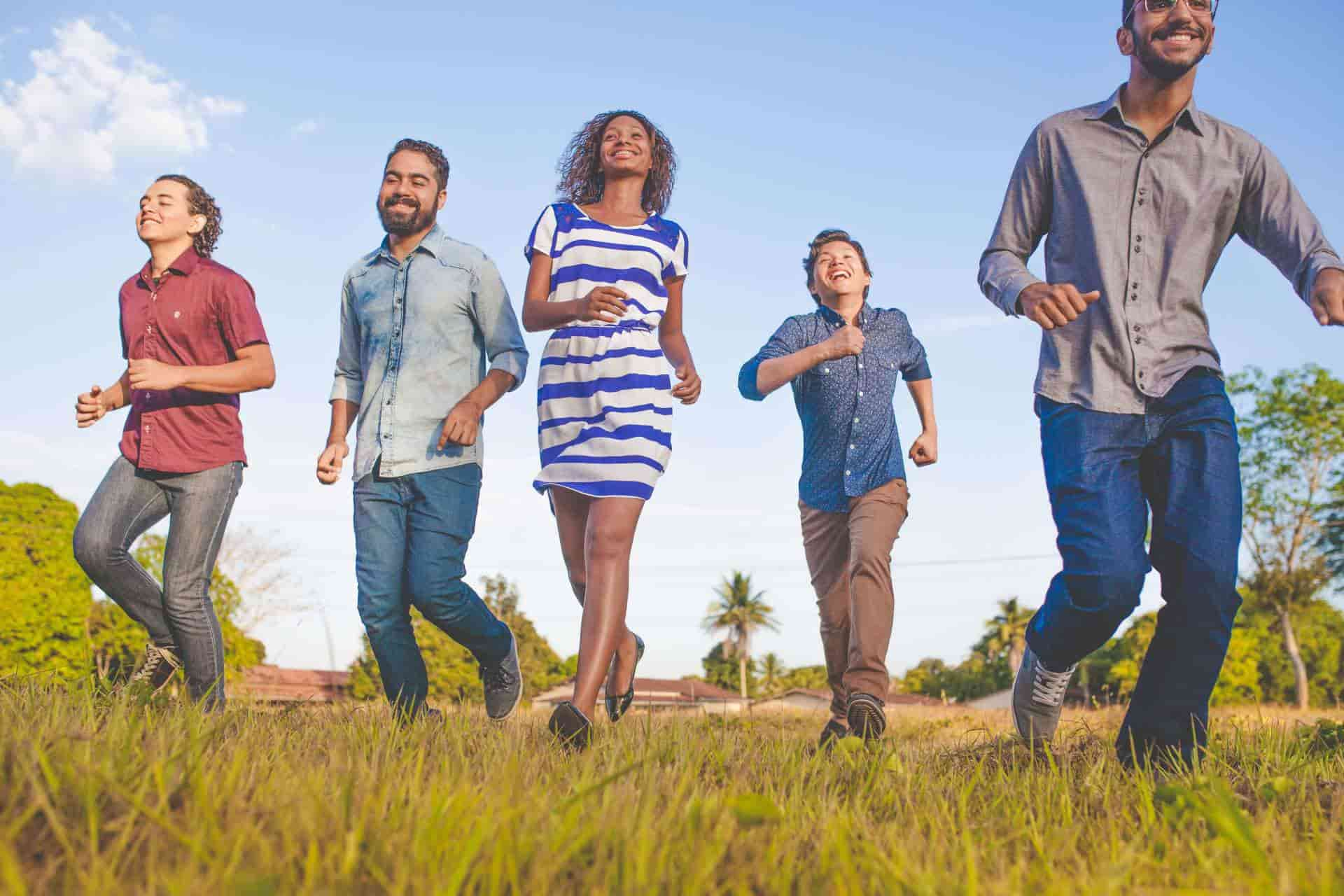 A groups of people running in a field